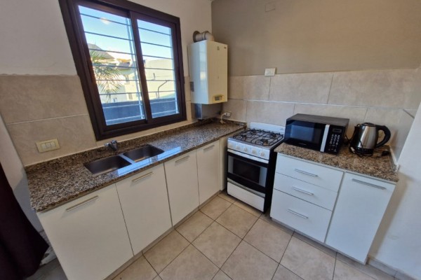 DEPARTAMENTO CENTRICO - UN DORMITORIO CON BALCON-PISCINA-COCHERA