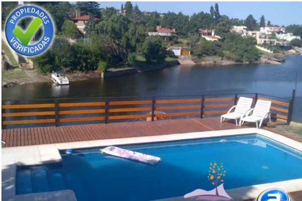 CASA PARA 8/10  SOBRE EL LAGO SAN ROQUE. HERMOSA VISTA. PILETA (COMPARTIDA)