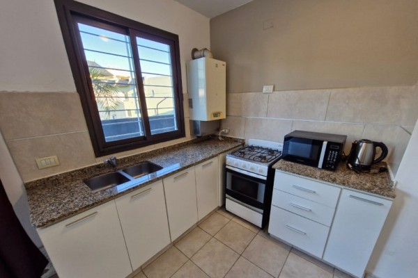 DEPARTAMENTO CENTRICO - UN DORMITORIO CON BALCON-PISCINA-COCHERA