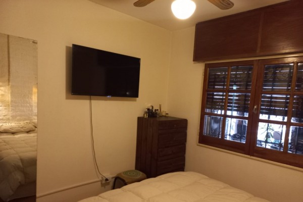 DEPARTAMENTO CENTRICO. UN DORMITORIO. PATIO Y PISCINA PROPIOS